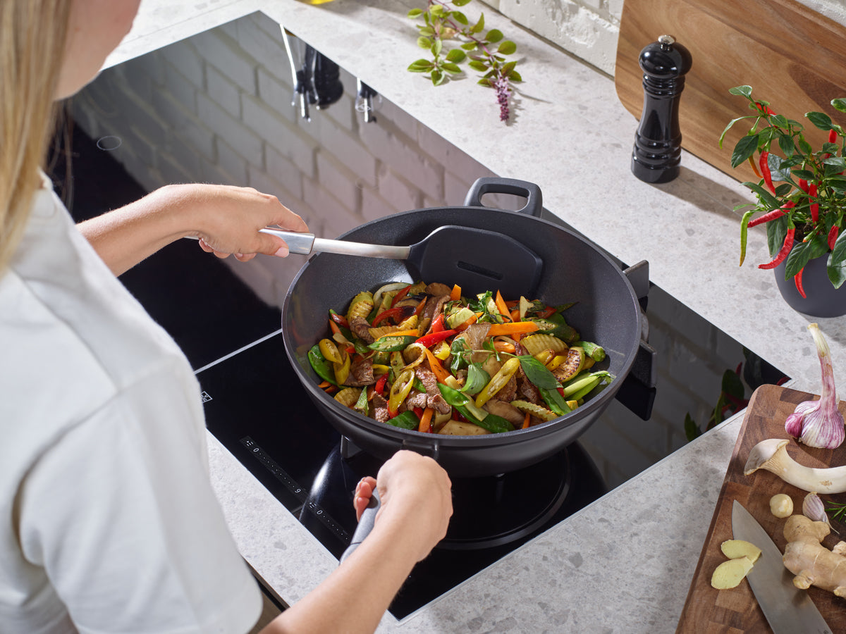Cook vibrant stir-fries in a Fissler Adamant® Wok, offering precision and durable non-stick innovation made in Germany.