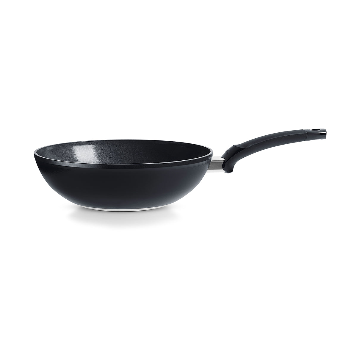 Fissler Ceratal® Wok in Orbit Black with black ceramic non-stick coating, ergonomic handle, shown on white. Made in Germany. Timeless design.