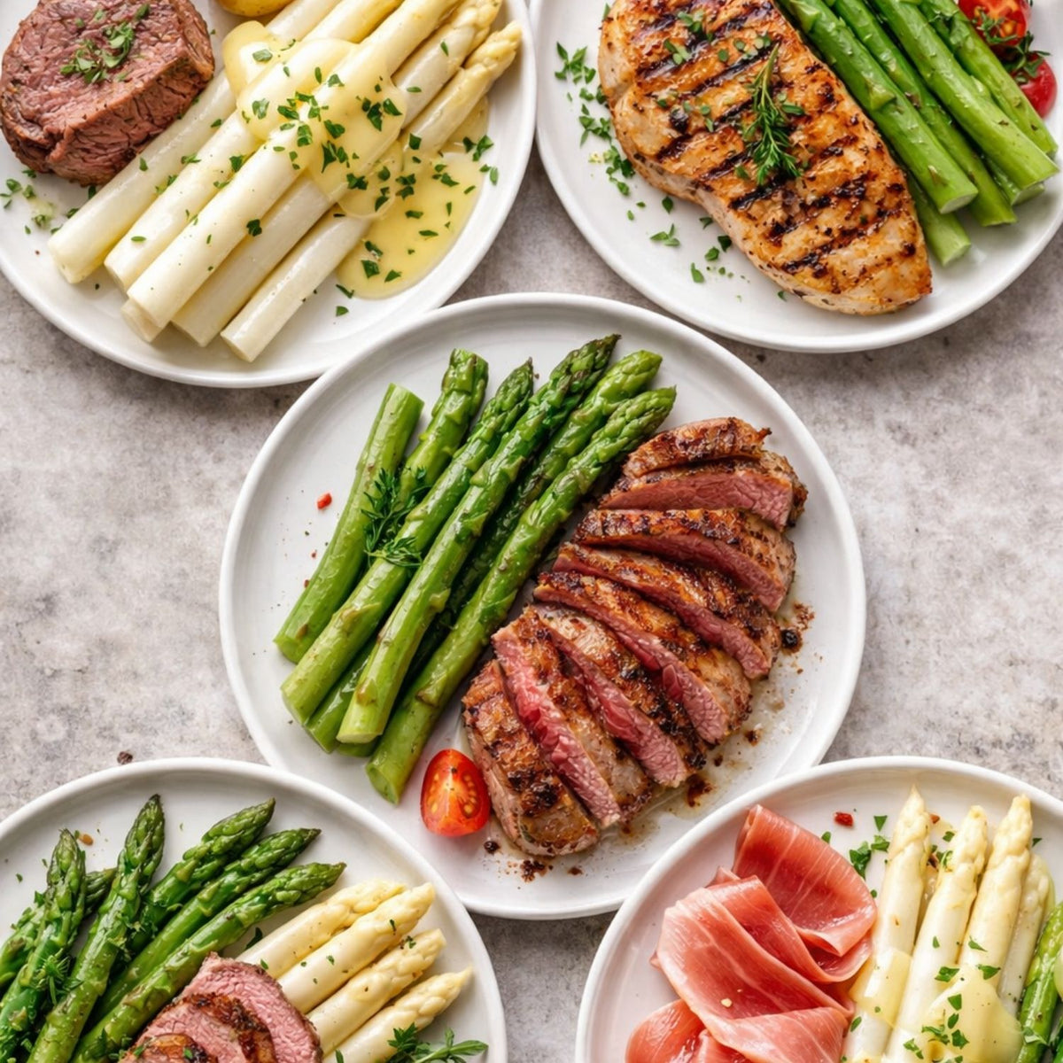 Fünf elegante Teller mit Spargel, Steak und Geflügel werden präsentiert, serviert auf Fissler-Edelstahlgeschirr.