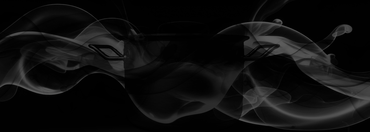Black and white image of a high-quality Fissler stainless steel pot with handles, enveloped in elegant steam against a dark background.